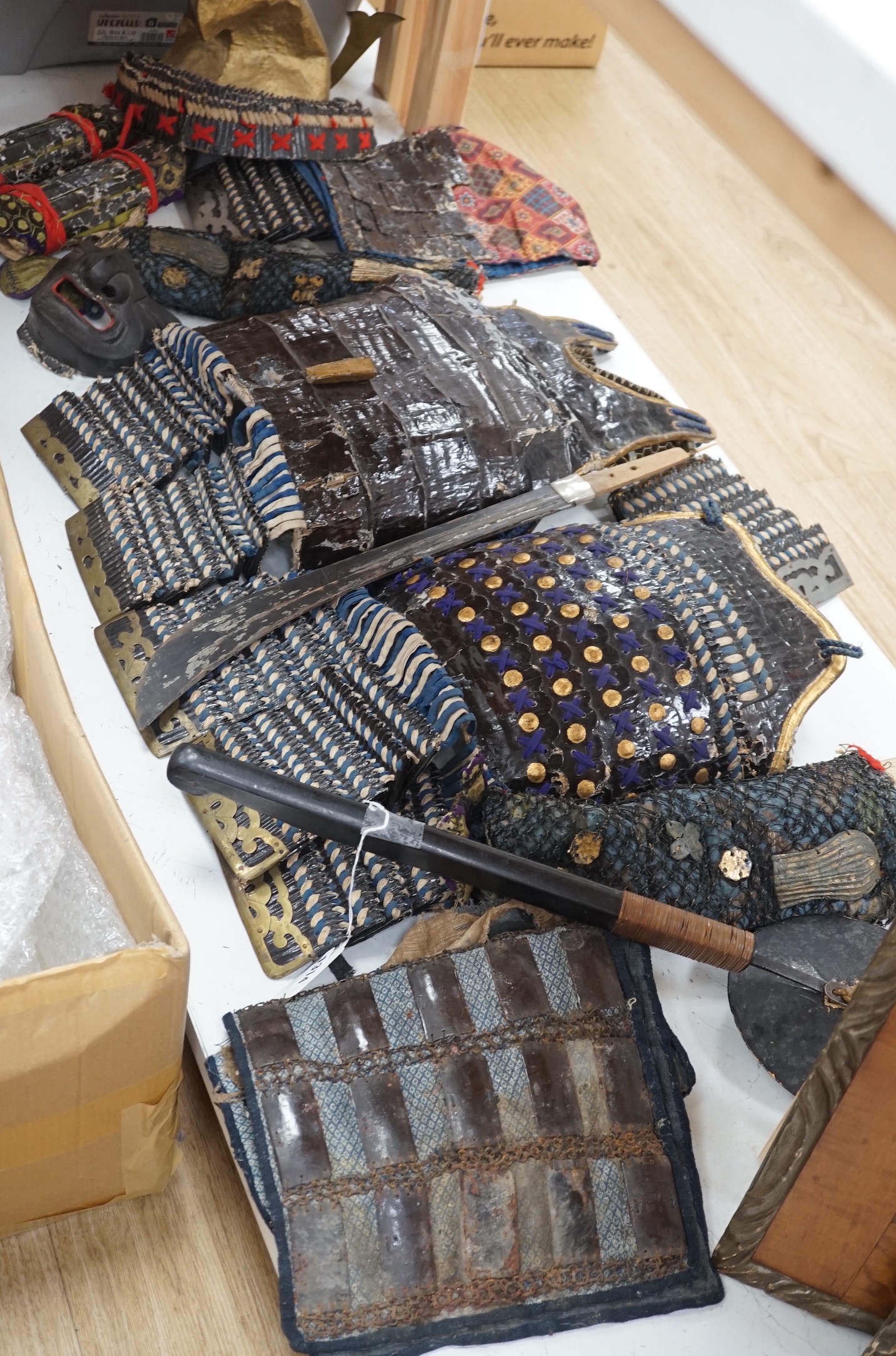 A 19th century Japanese papier mache and fabric samurai warrior costume for a child or puppet, part face mask, hat and faux chain mail bodice